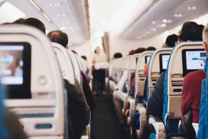 shallow focus photography of people inside of passenger plane